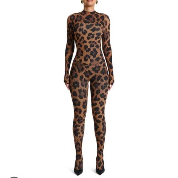 naked wardrobe Pants - 42. Naked Wardrobe $118 animal print closed toe jumpsuit